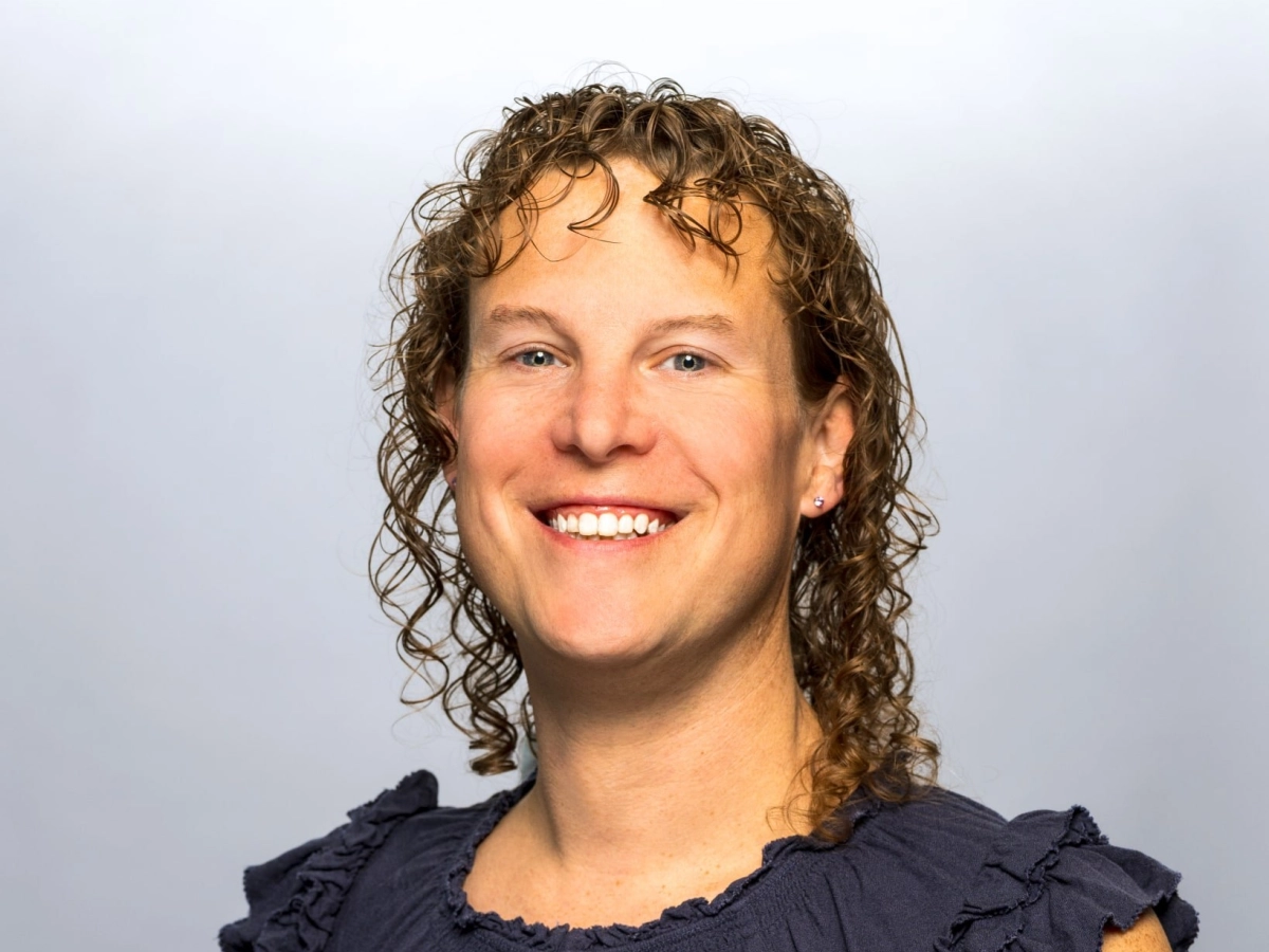 Jamie Phillips, Treasurer, smiling in the middle of the picture